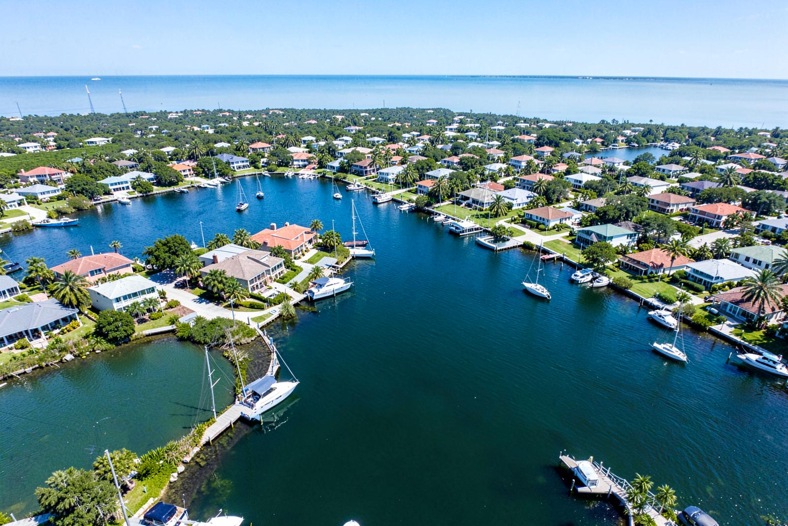 Aerial view of Cape Coral neighborhoods, canals and the Gulf coastline