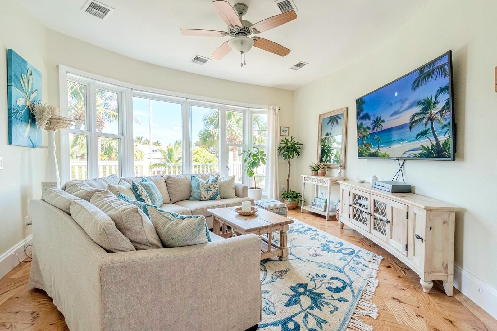 Living room with sectional sofas and wall-mounted TV