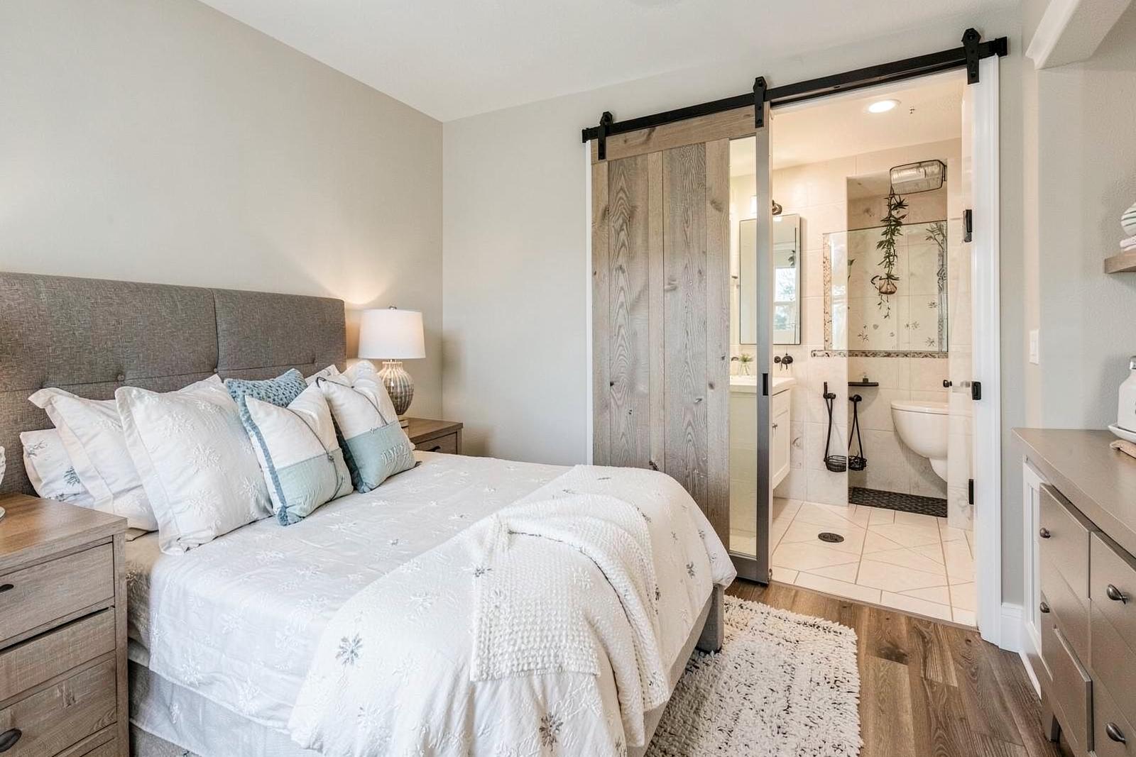 King bedroom with en-suite bath and barn door